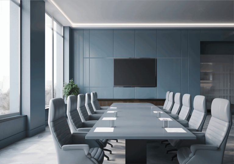 muted blue board room with large flatscreen monitor mounted on wall